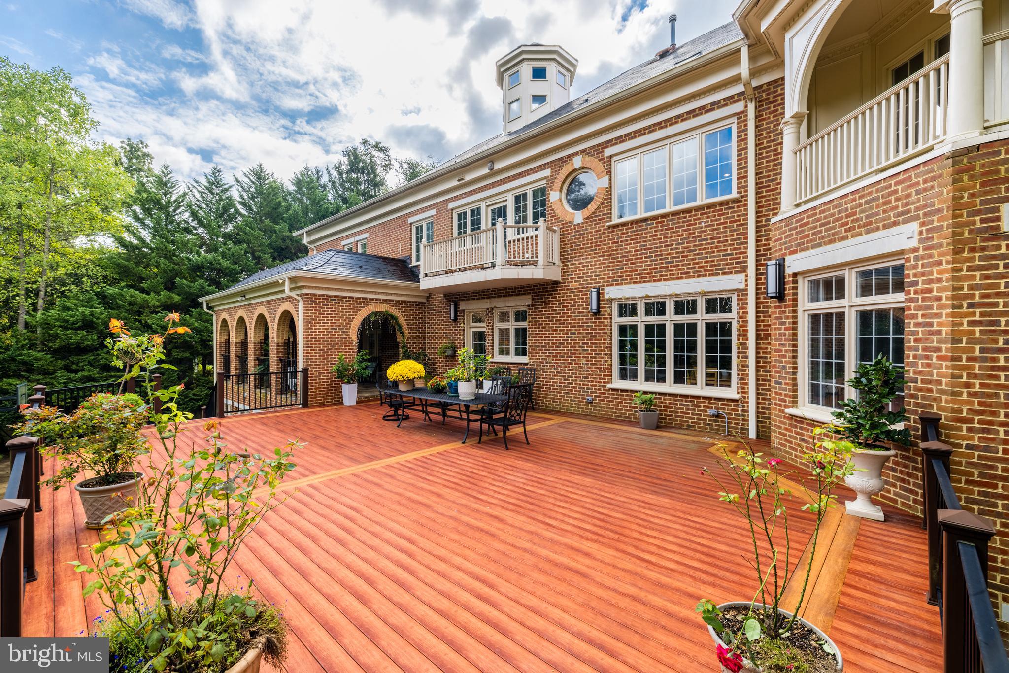 6832 Georgetown Pike McLean, VA 22101 - Photo 21 of 25 a view of a house with backyard sitting area and garden