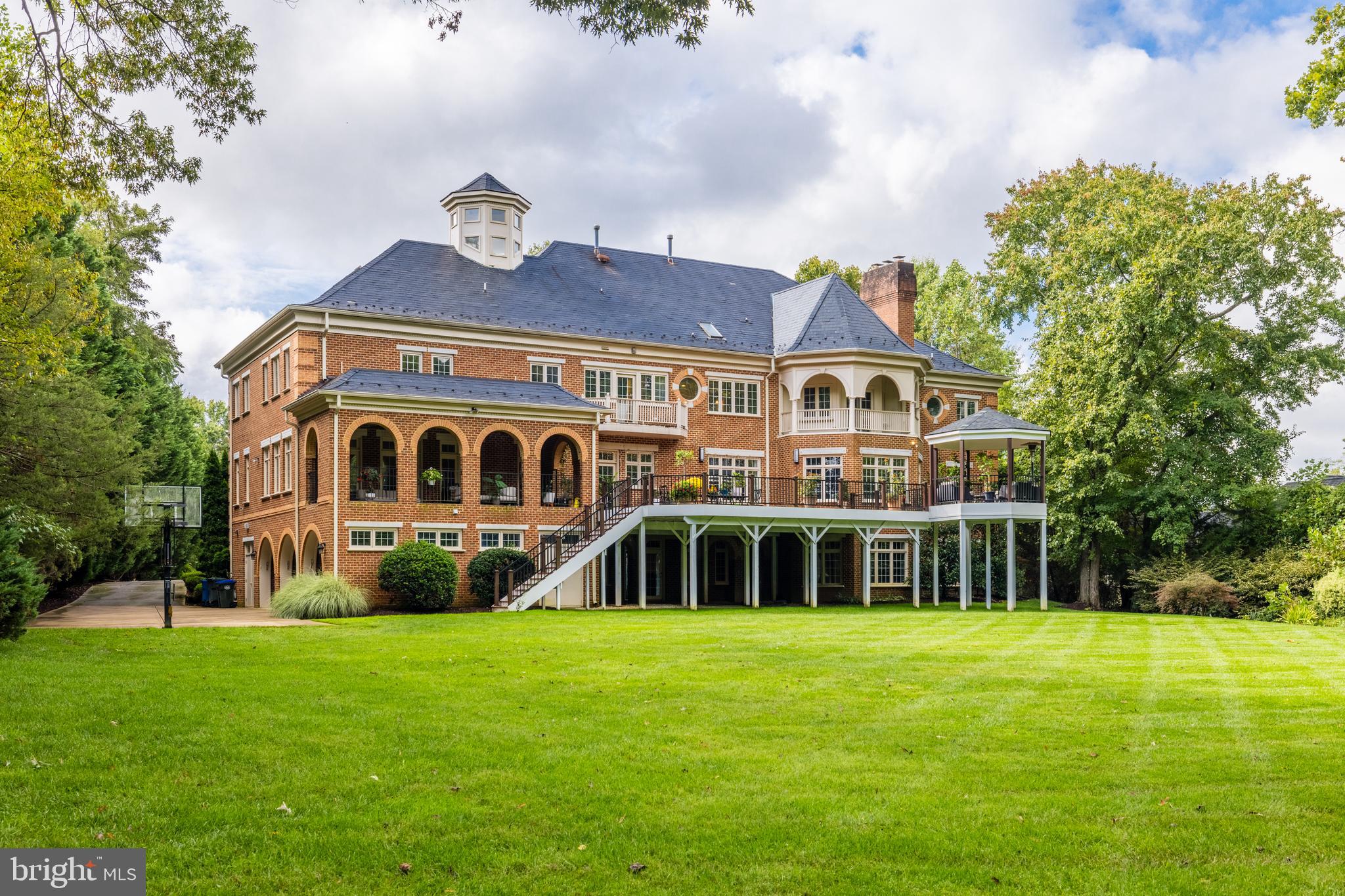 6832 Georgetown Pike McLean, VA 22101 - Photo 22 of 25 a front view of a house with garden