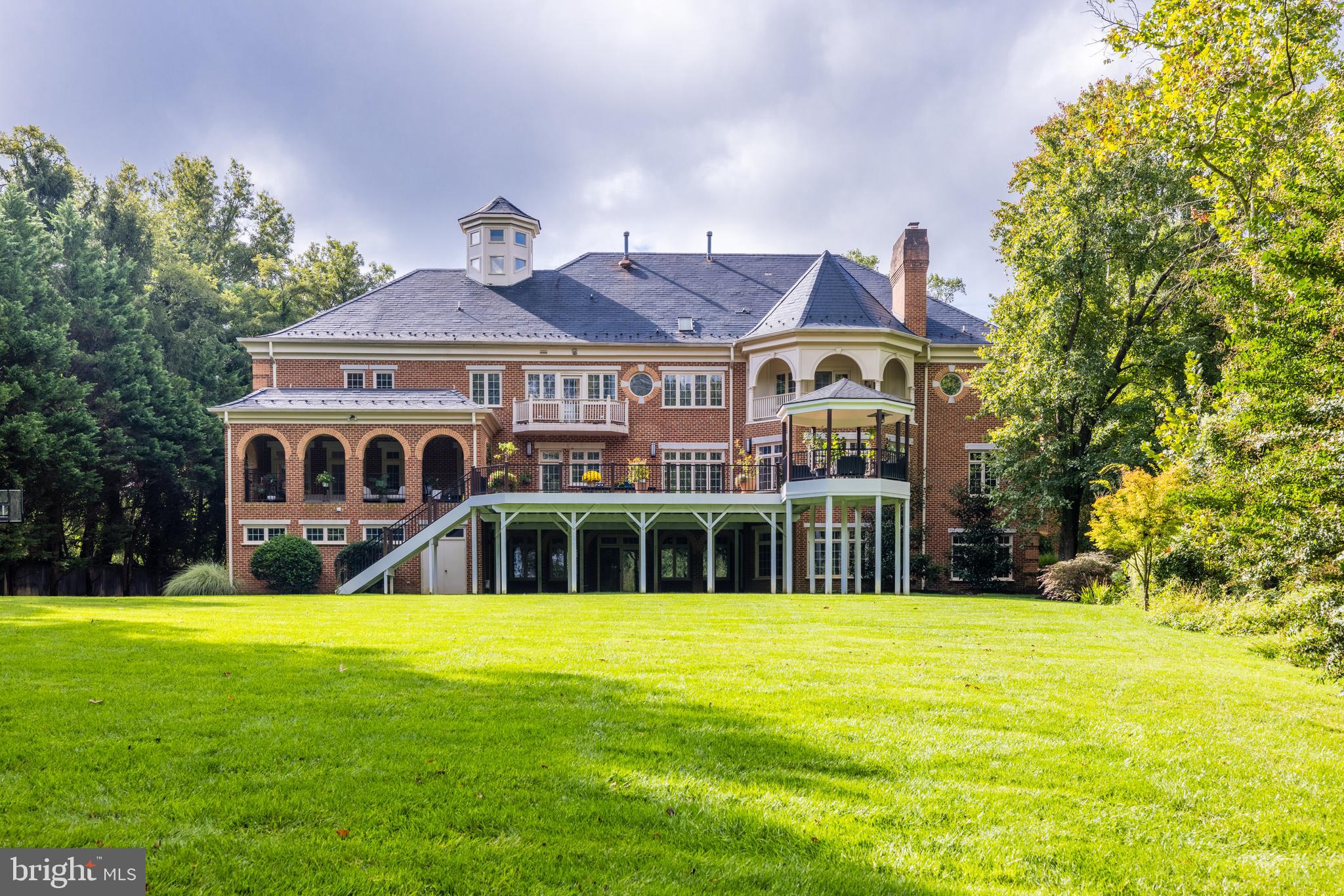 6832 Georgetown Pike McLean, VA 22101 - Photo 23 of 25 a front view of house with yard and green space