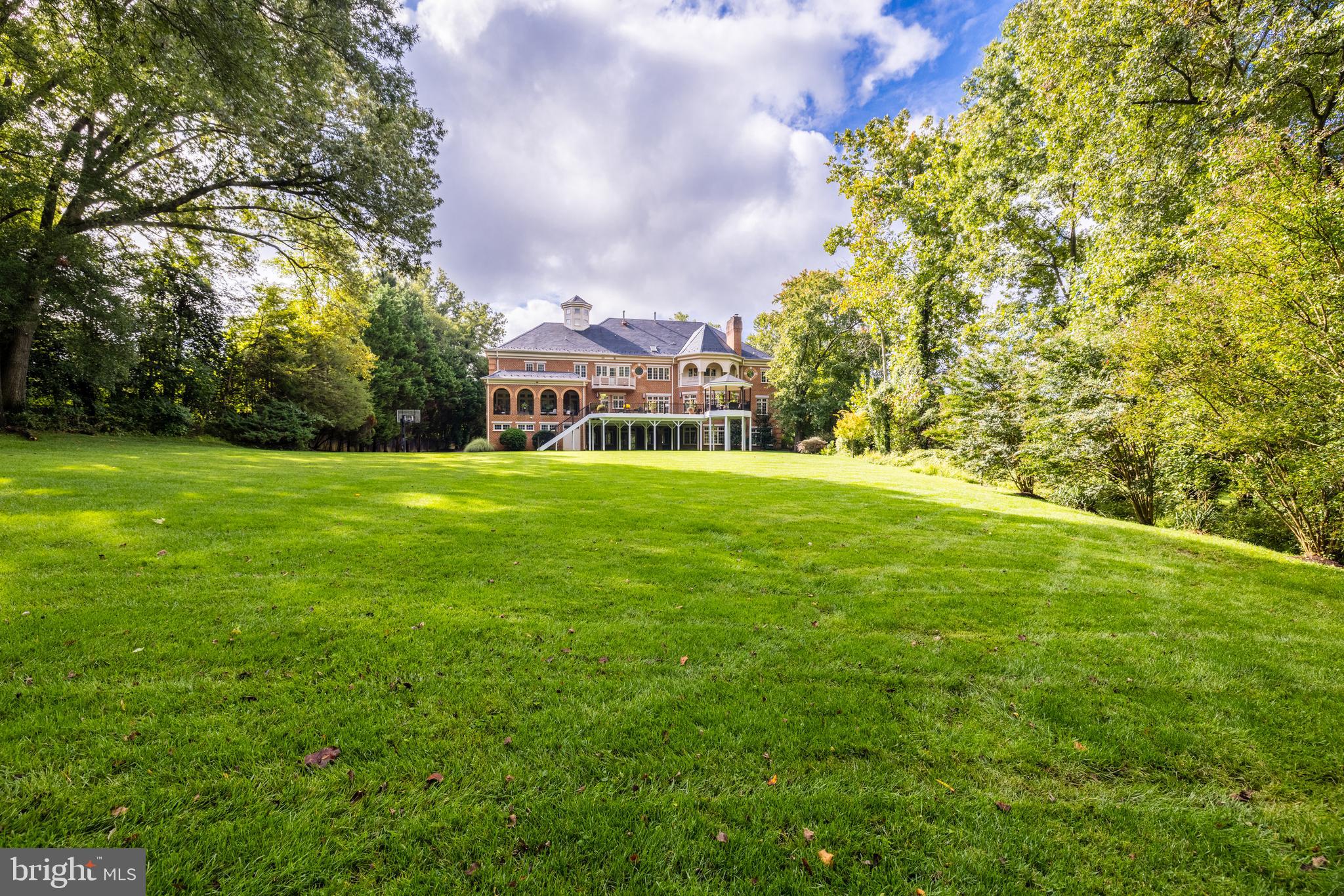 6832 Georgetown Pike McLean, VA 22101 - Photo 24 of 25 a view of a big yard with a house in the background