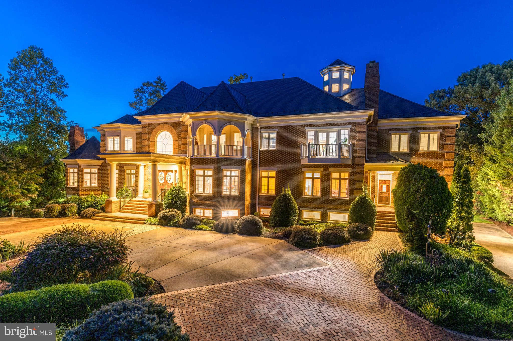 6832 Georgetown Pike McLean, VA 22101 - Photo 3 of 25 a front view of a house with a yard