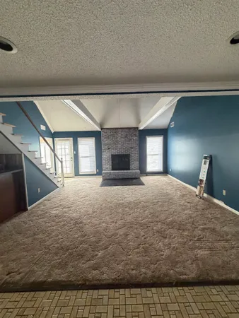 an empty room with a empty space and a ceiling fan