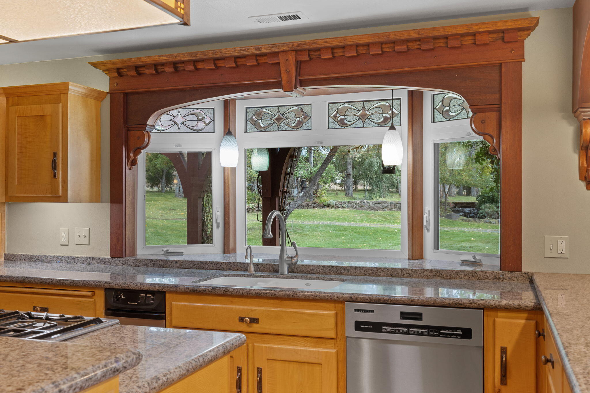 21925 Bear Creek Road Bend, OR 97702 - Photo 28 of 104 a kitchen with a stove and a sink