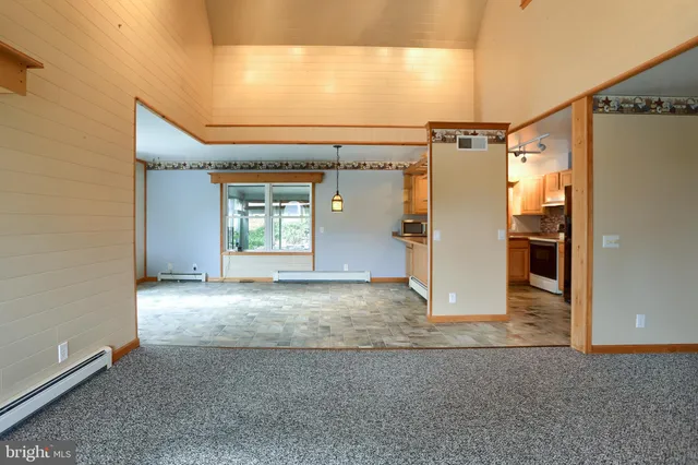 a kitchen with stainless steel appliances granite countertop a stove and a sink