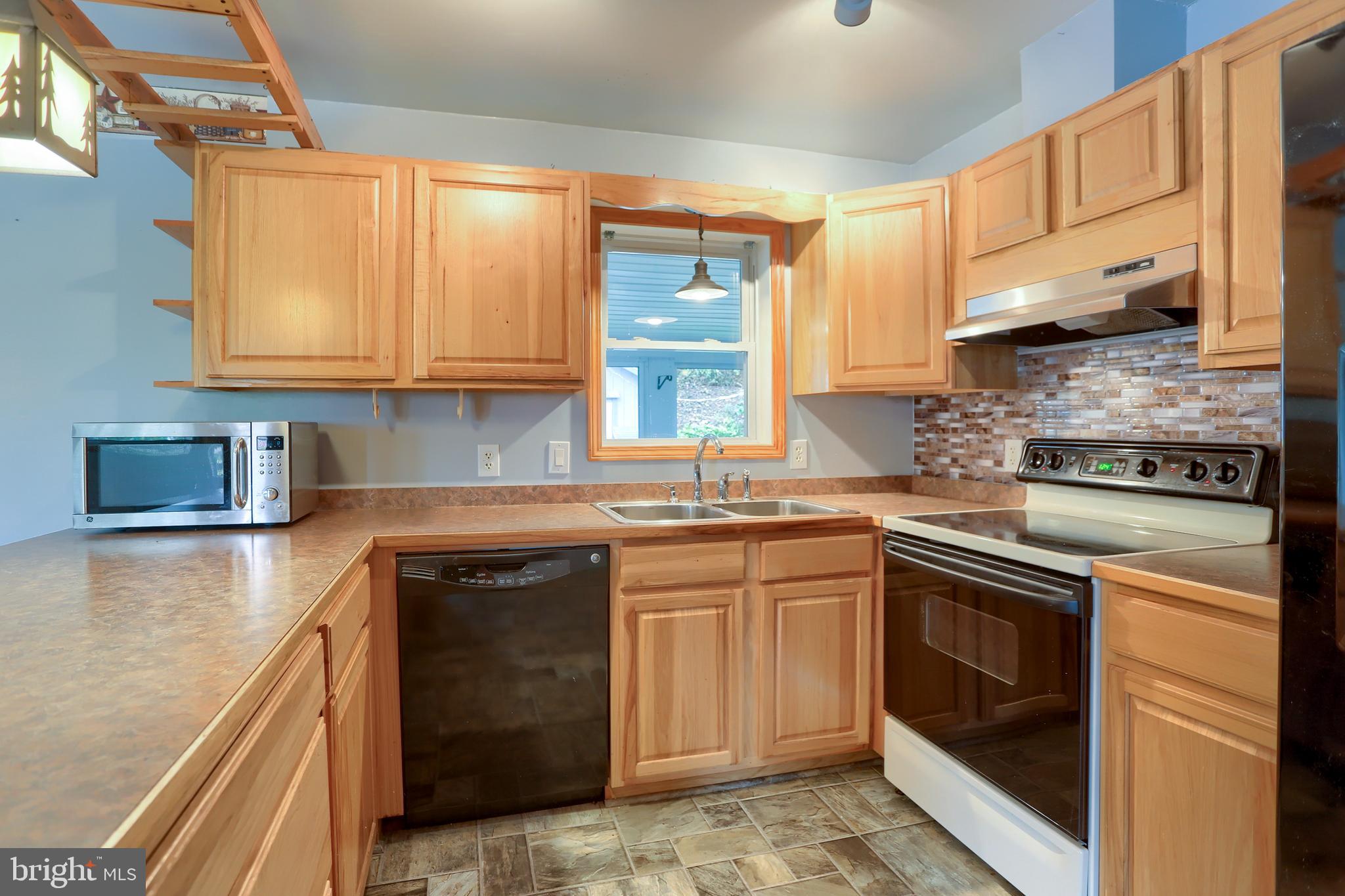 2130 Susquehanna Trail Liverpool, PA 17045 - Photo 33 of 54 a kitchen with stainless steel appliances granite countertop a stove and a sink