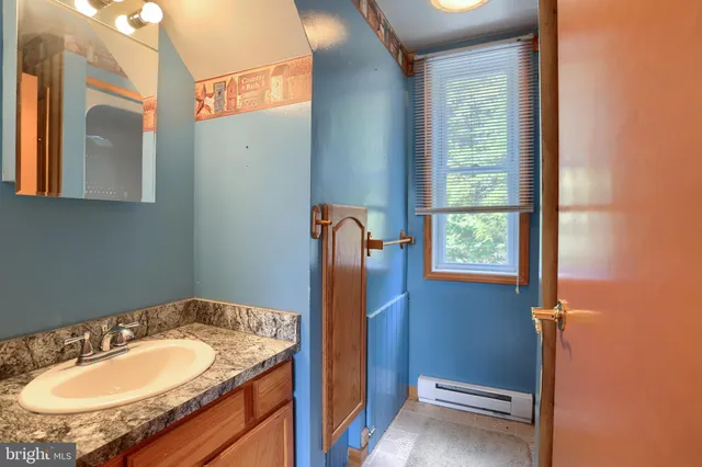 a view of a room with window and furniture