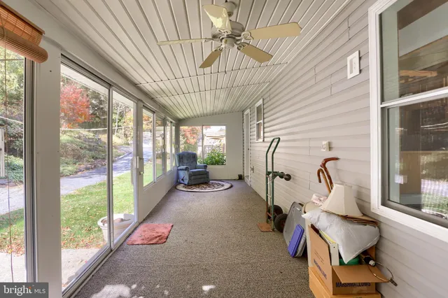 a view of a bathroom with shower and curtain