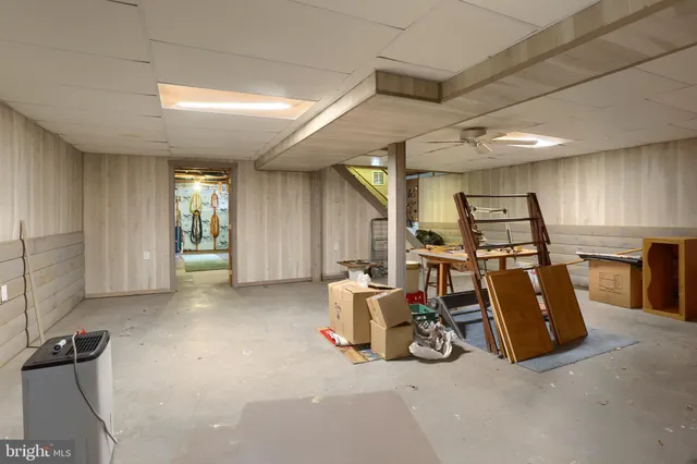 a view of a room with wooden walls
