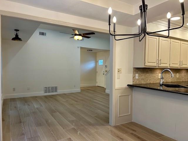 17119 Upper Bay Road Addison, TX 75001 - Photo 4 of 29 a view of a storage & utility room with wooden floor
