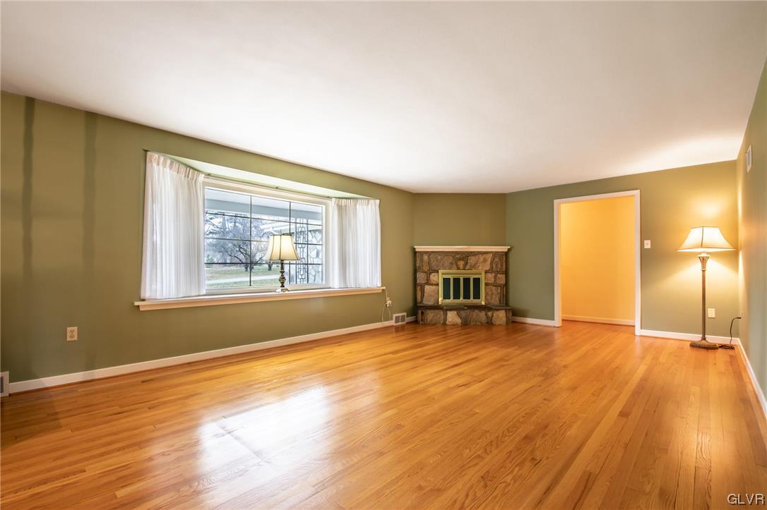 330 Wedgewood Road Bethlehem, PA 18017 - Photo 14 of 47 a view of an empty room with wooden floor and a window