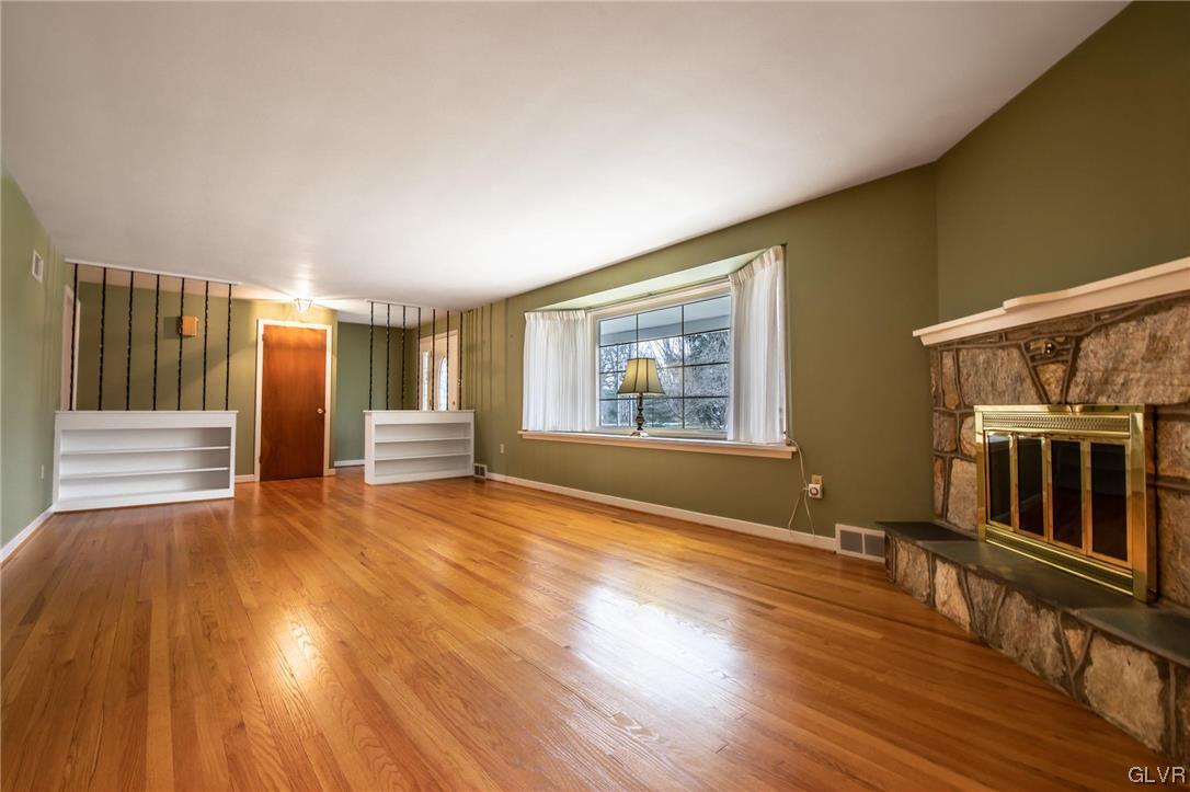 330 Wedgewood Road Bethlehem, PA 18017 - Photo 15 of 47 a view of an empty room with wooden floor and windows