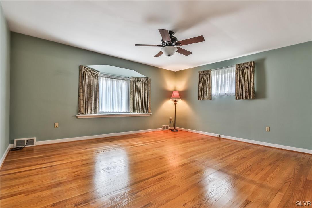 330 Wedgewood Road Bethlehem, PA 18017 - Photo 26 of 47 a view of an empty room with window and wooden floor