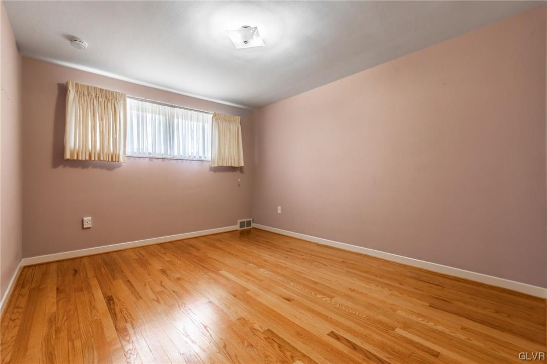 330 Wedgewood Road Bethlehem, PA 18017 - Photo 34 of 47 a view of an empty room with wooden floor and a window