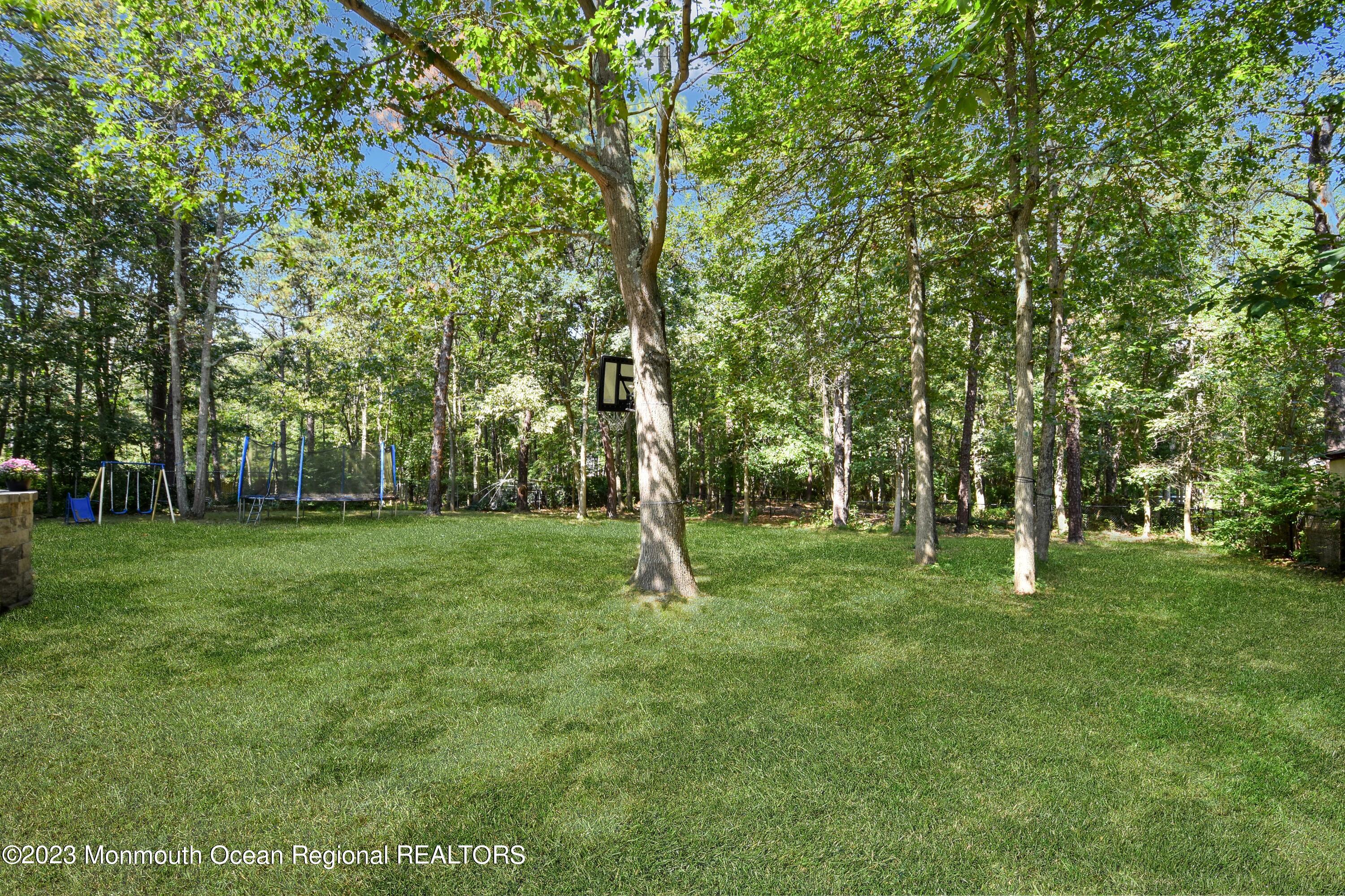 758 Anderson Road Jackson, NJ 08527 - Photo 34 of 35 a view of outdoor space with deck and yard