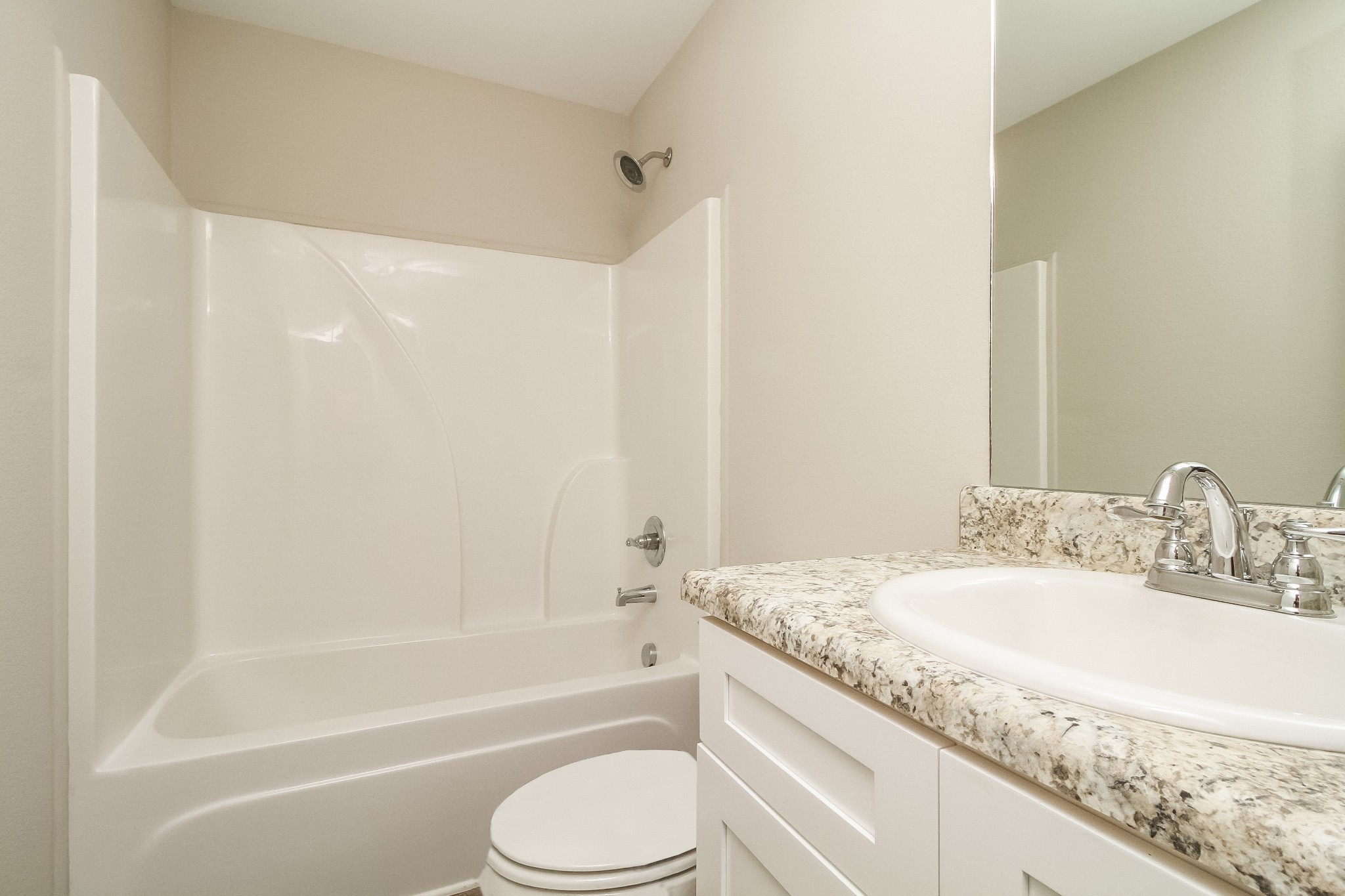 1237 Catawba Way Murfreesboro, TN 37130 - Photo 14 of 18 a bathroom with a granite countertop sink a toilet and bathtub
