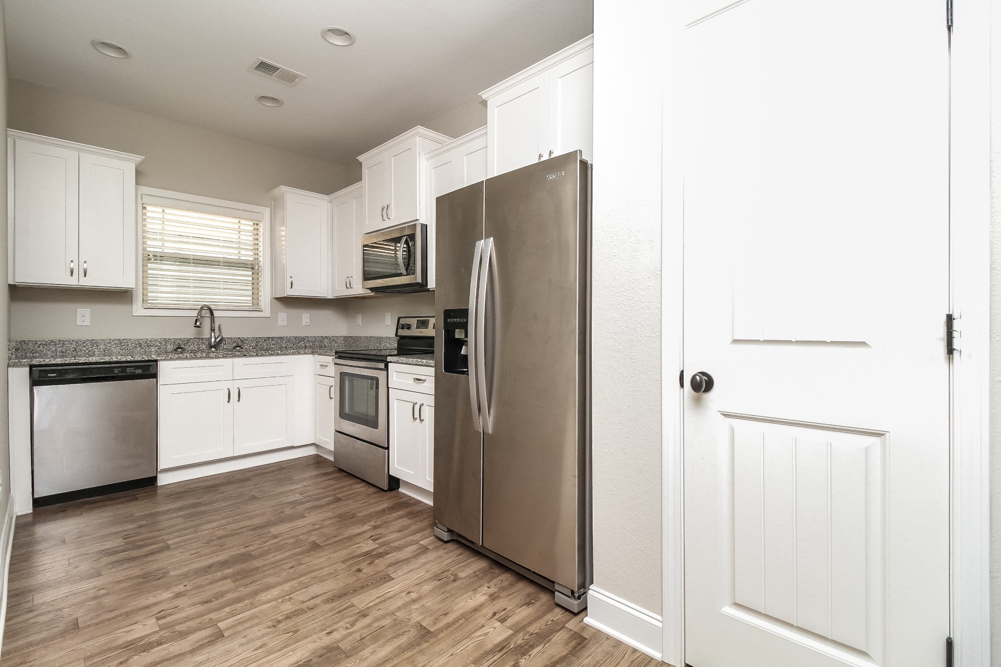 1237 Catawba Way Murfreesboro, TN 37130 - Photo 4 of 18 a kitchen with a white cabinets and stainless steel appliances