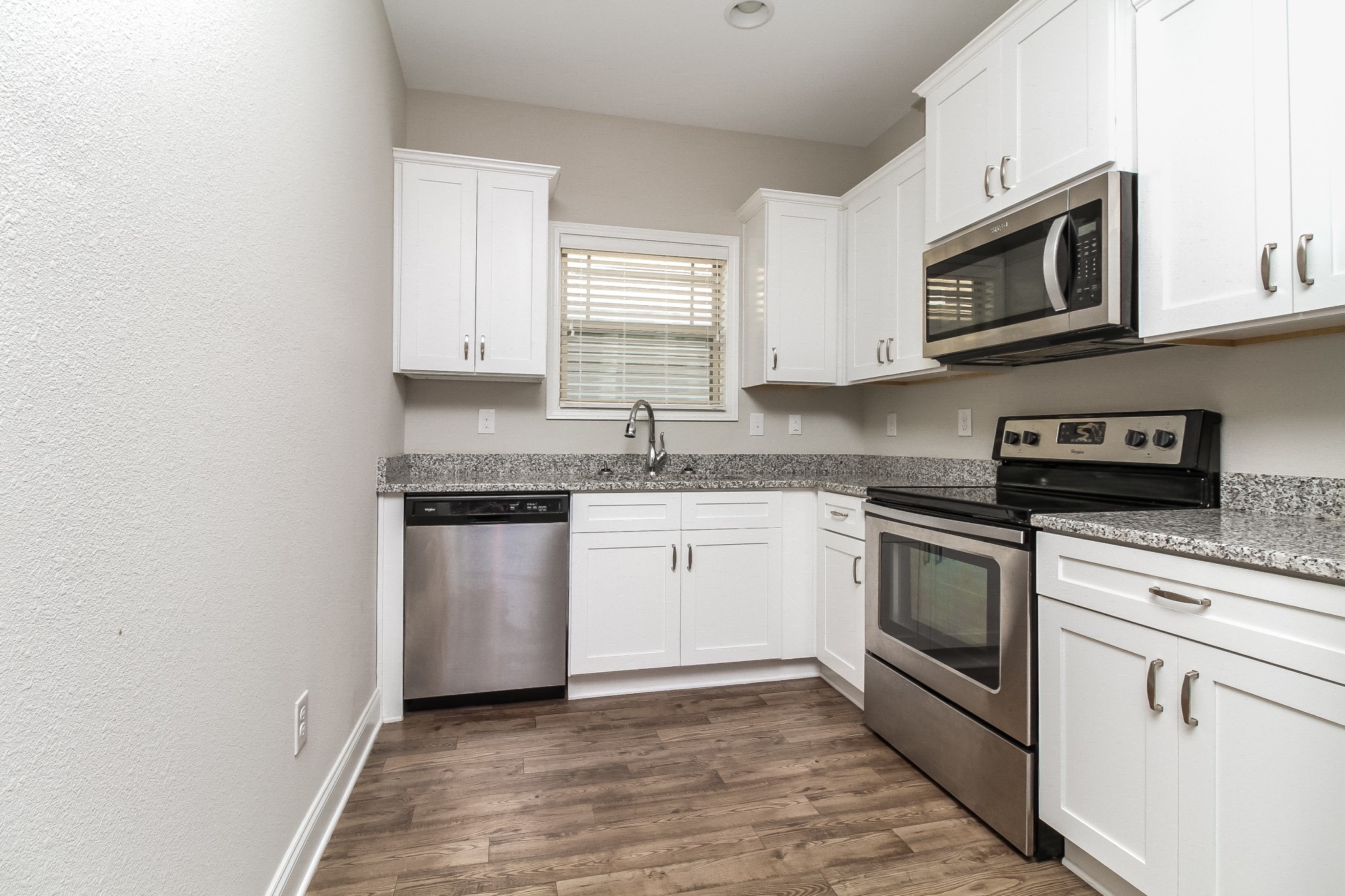 1237 Catawba Way Murfreesboro, TN 37130 - Photo 5 of 18 a kitchen with stainless steel appliances granite countertop a sink a stove a microwave and cabinets