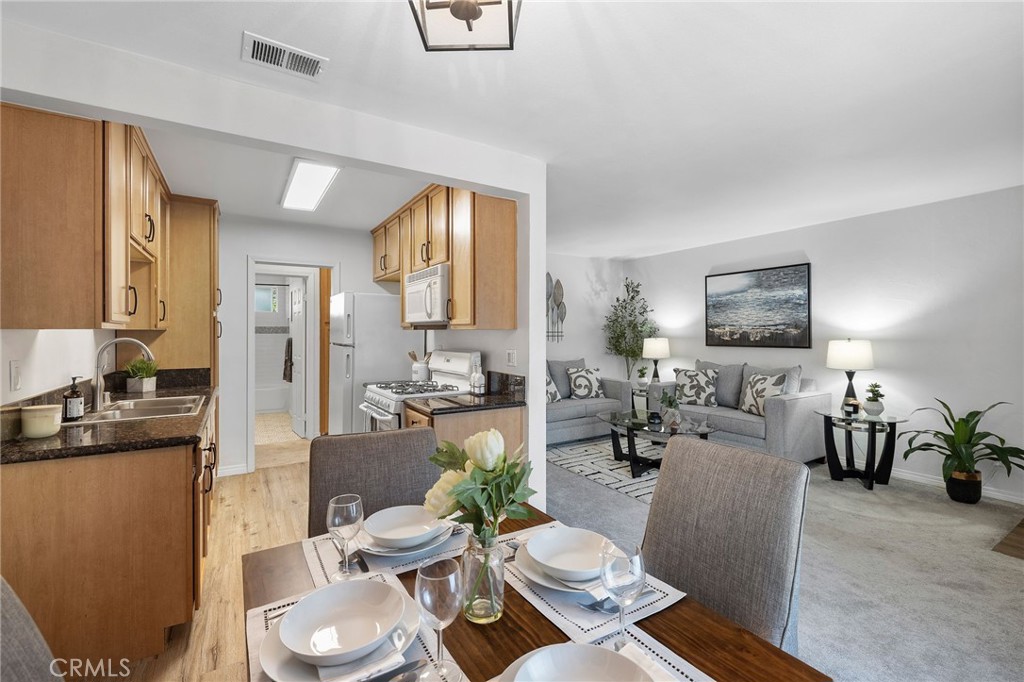 1450 West Lambert Road, Unit 358 La Habra, CA 90631 - Photo 11 of 31 a living room with furniture and wooden floor