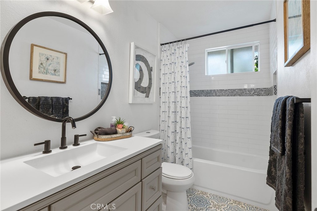 1450 West Lambert Road, Unit 358 La Habra, CA 90631 - Photo 16 of 31 a bathroom with a sink mirror toilet and bathtub