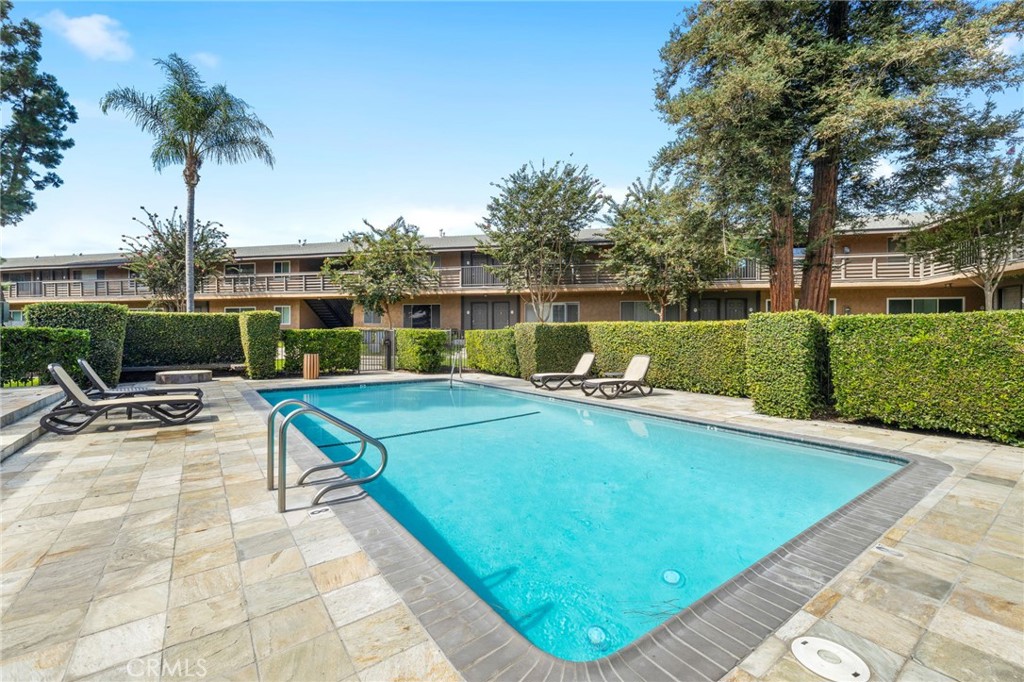 1450 West Lambert Road, Unit 358 La Habra, CA 90631 - Photo 24 of 31 a view of swimming pool with outdoor seating and plants