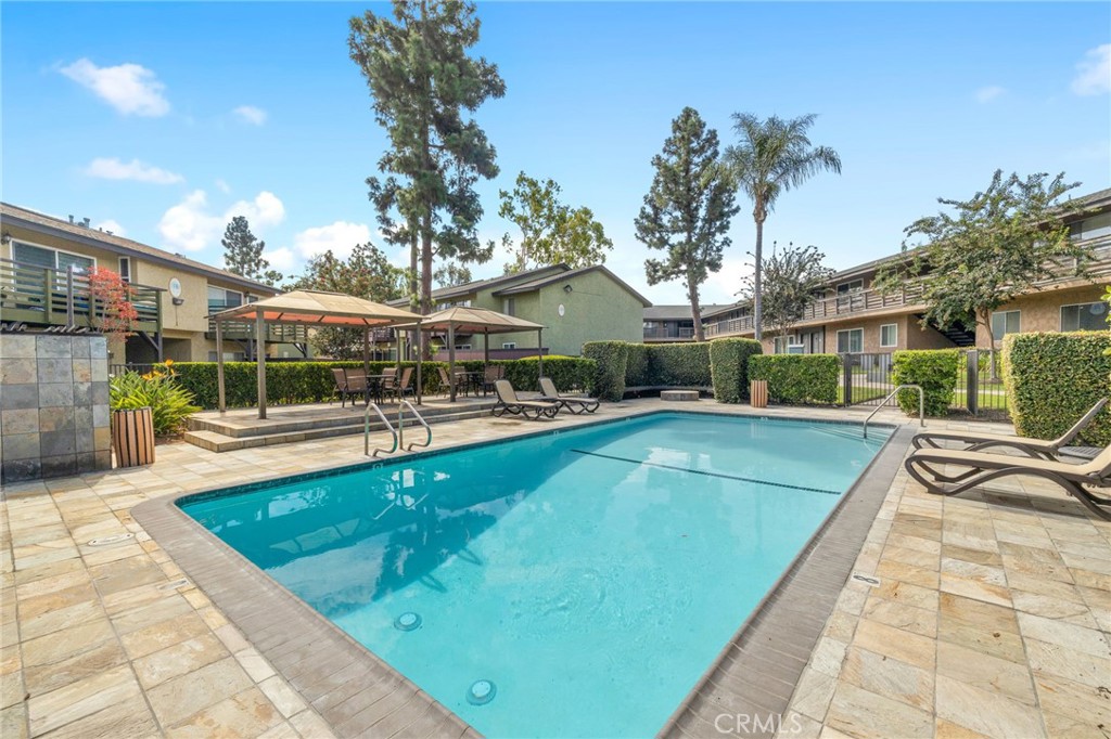 1450 West Lambert Road, Unit 358 La Habra, CA 90631 - Photo 25 of 31 a view of a swimming pool with a patio