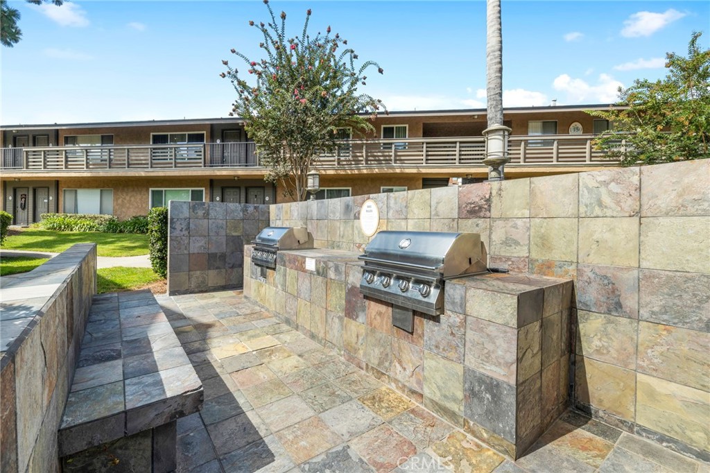 1450 West Lambert Road, Unit 358 La Habra, CA 90631 - Photo 28 of 31 a building outdoor space with patio furniture