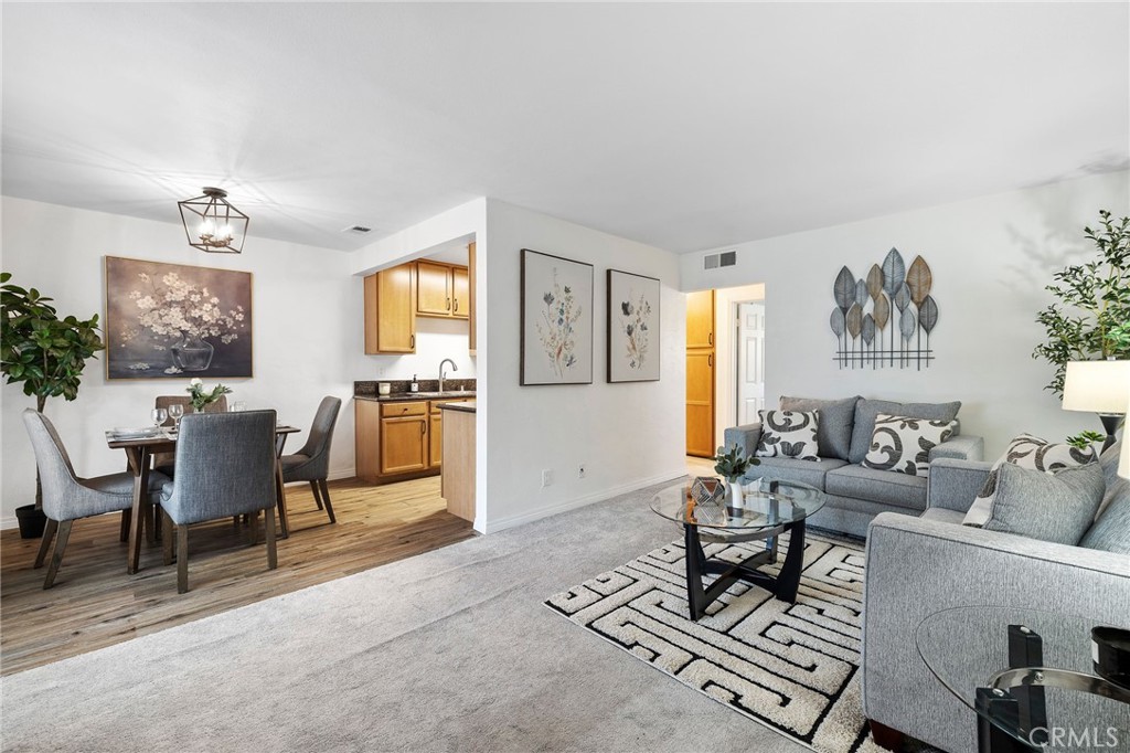 1450 West Lambert Road, Unit 358 La Habra, CA 90631 - Photo 5 of 31 a living room with furniture and a dining table with rug kitchen