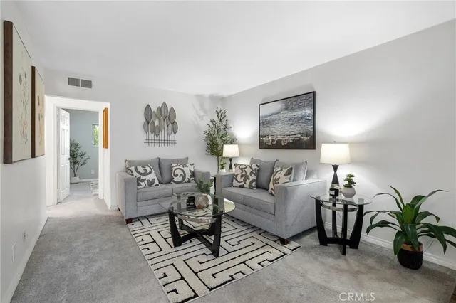 a living room with furniture and a couch