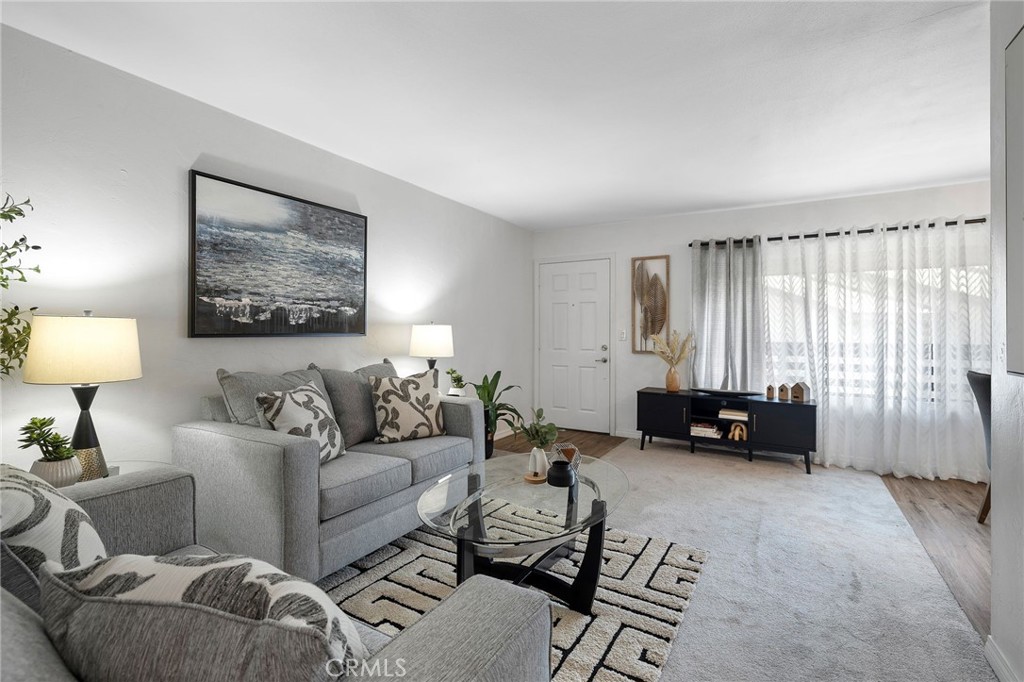 1450 West Lambert Road, Unit 358 La Habra, CA 90631 - Photo 7 of 31 a living room with furniture and a couch