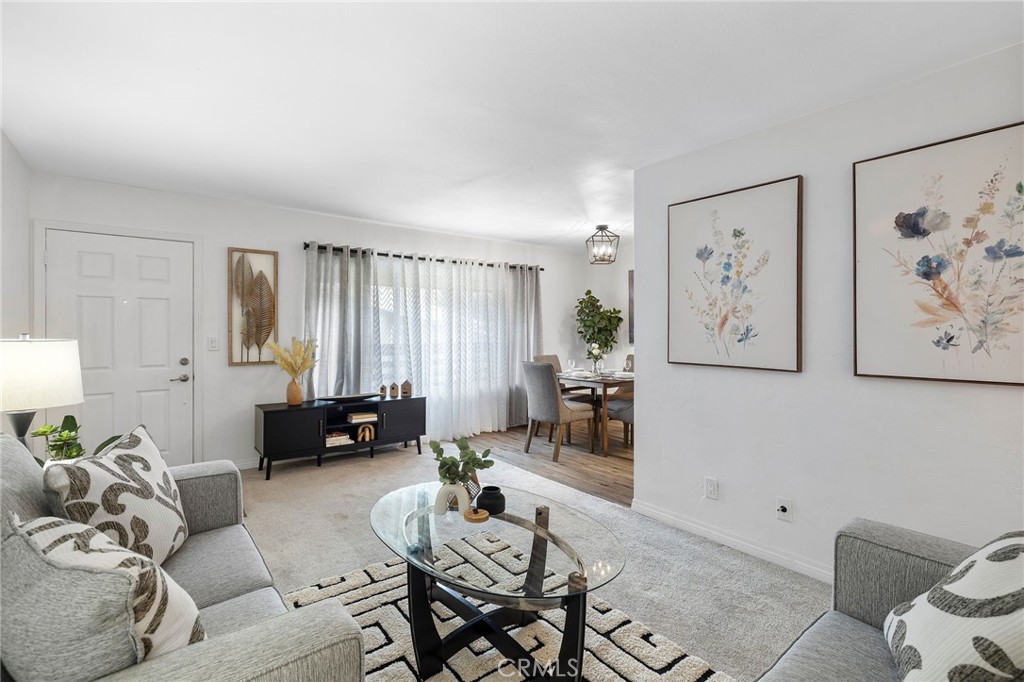 1450 West Lambert Road, Unit 358 La Habra, CA 90631 - Photo 8 of 31 a living room with furniture and wooden floor