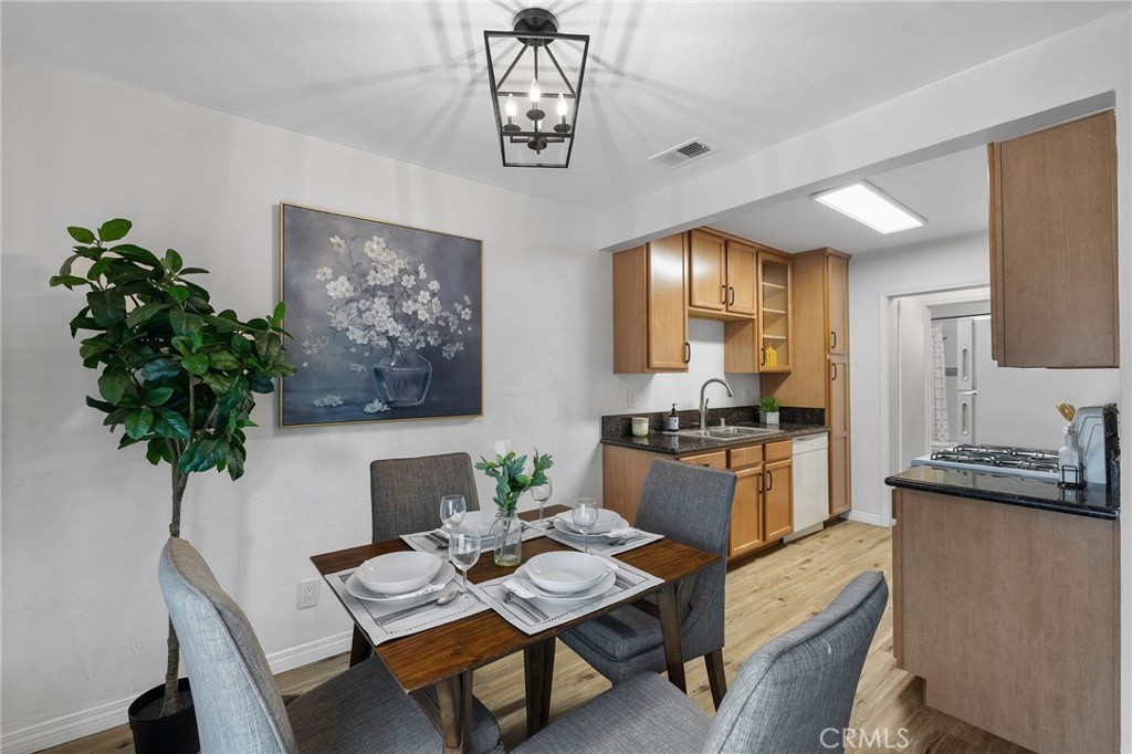 1450 West Lambert Road, Unit 358 La Habra, CA 90631 - Photo 10 of 31 a kitchen with a table and chairs in it