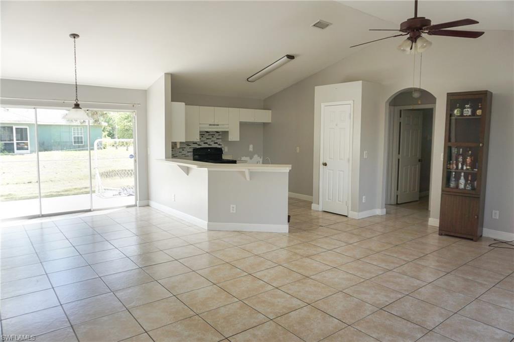 3703 Sunset Road Lehigh Acres, FL 33971 - Photo 3 of 12 a view of a kitchen with furniture and a window