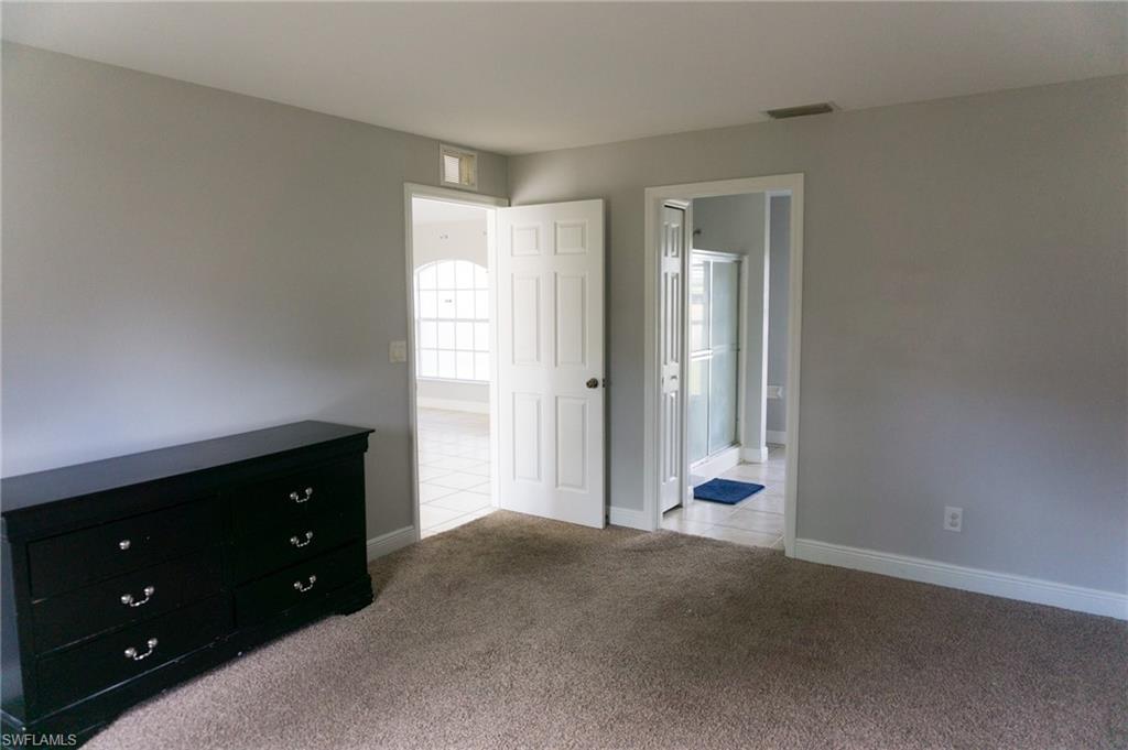 3703 Sunset Road Lehigh Acres, FL 33971 - Photo 6 of 12 a view of an empty room with closet and a window