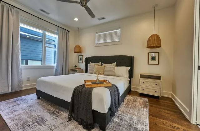 a bedroom with a bed and a window