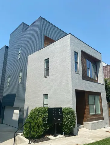 a front view of a house with garage