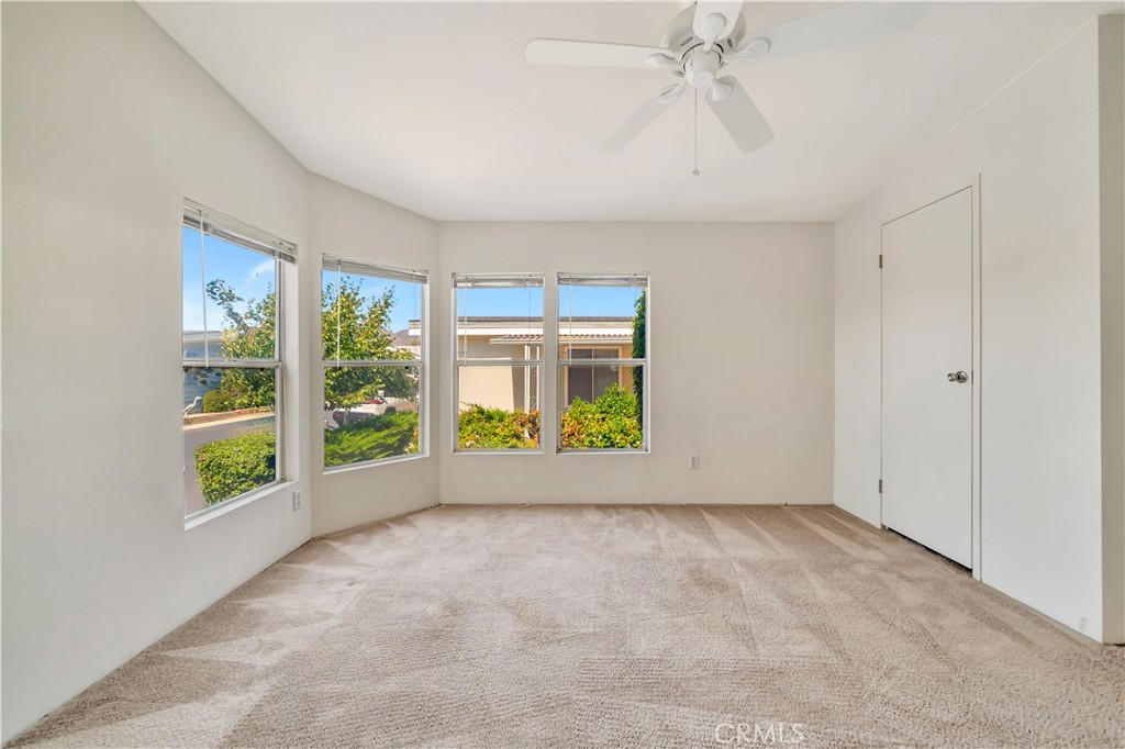 24 Gitana Avenue, Unit 164 Camarillo, CA 93012 - Photo 29 of 52 an empty room with windows and garden view