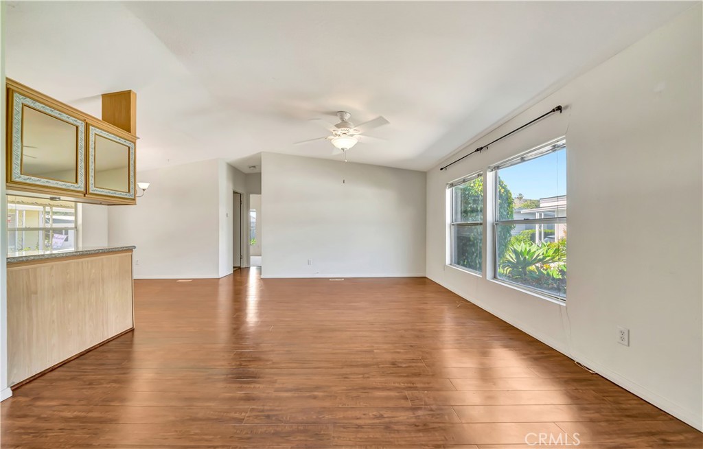 24 Gitana Avenue, Unit 164 Camarillo, CA 93012 - Photo 7 of 52 a view of an empty room with window and wooden floor