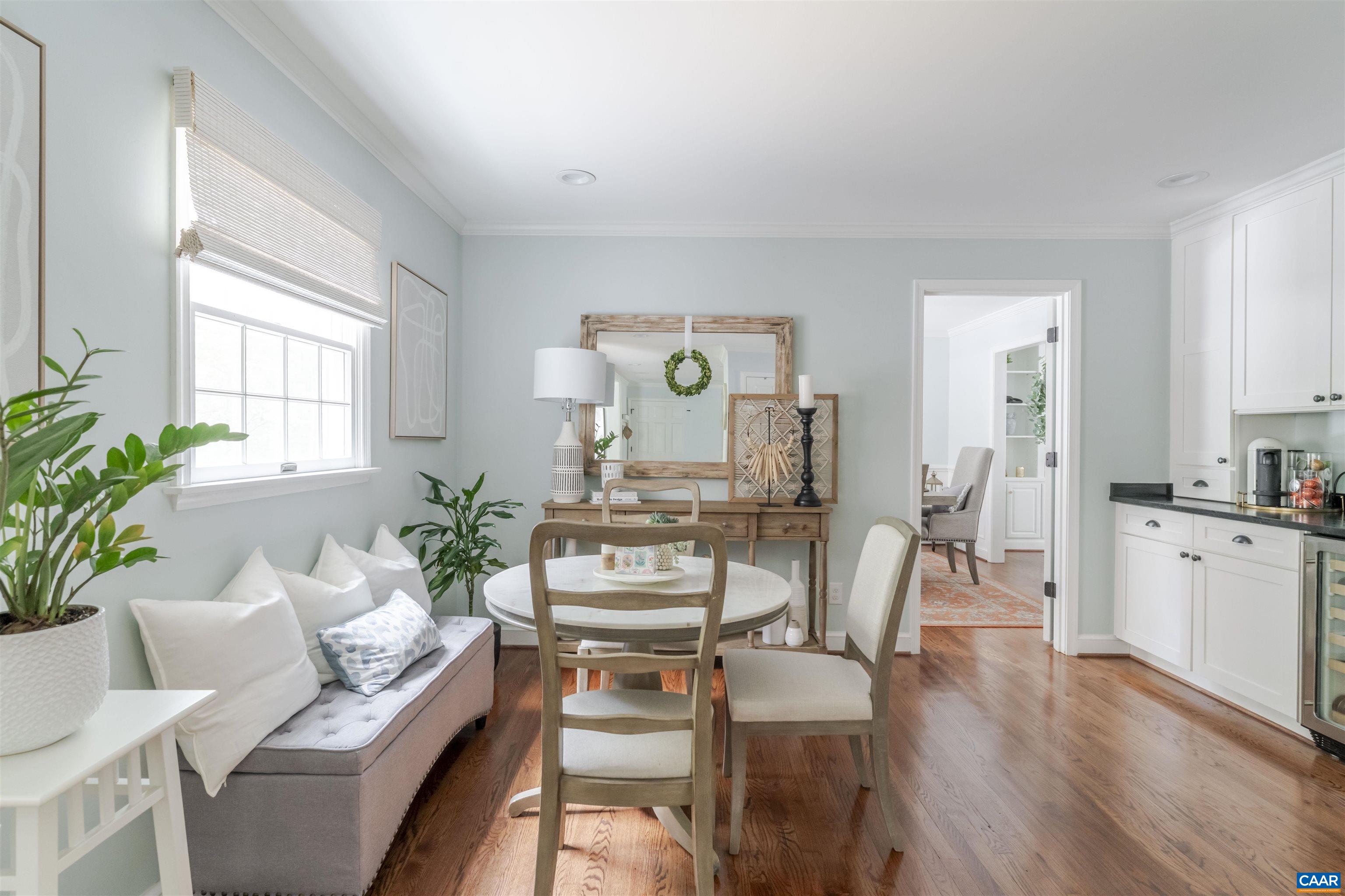 3359 Marsden Point Keswick, VA 22947 - Photo 17 of 47 a living room with furniture a dining table with wooden floor and a large window