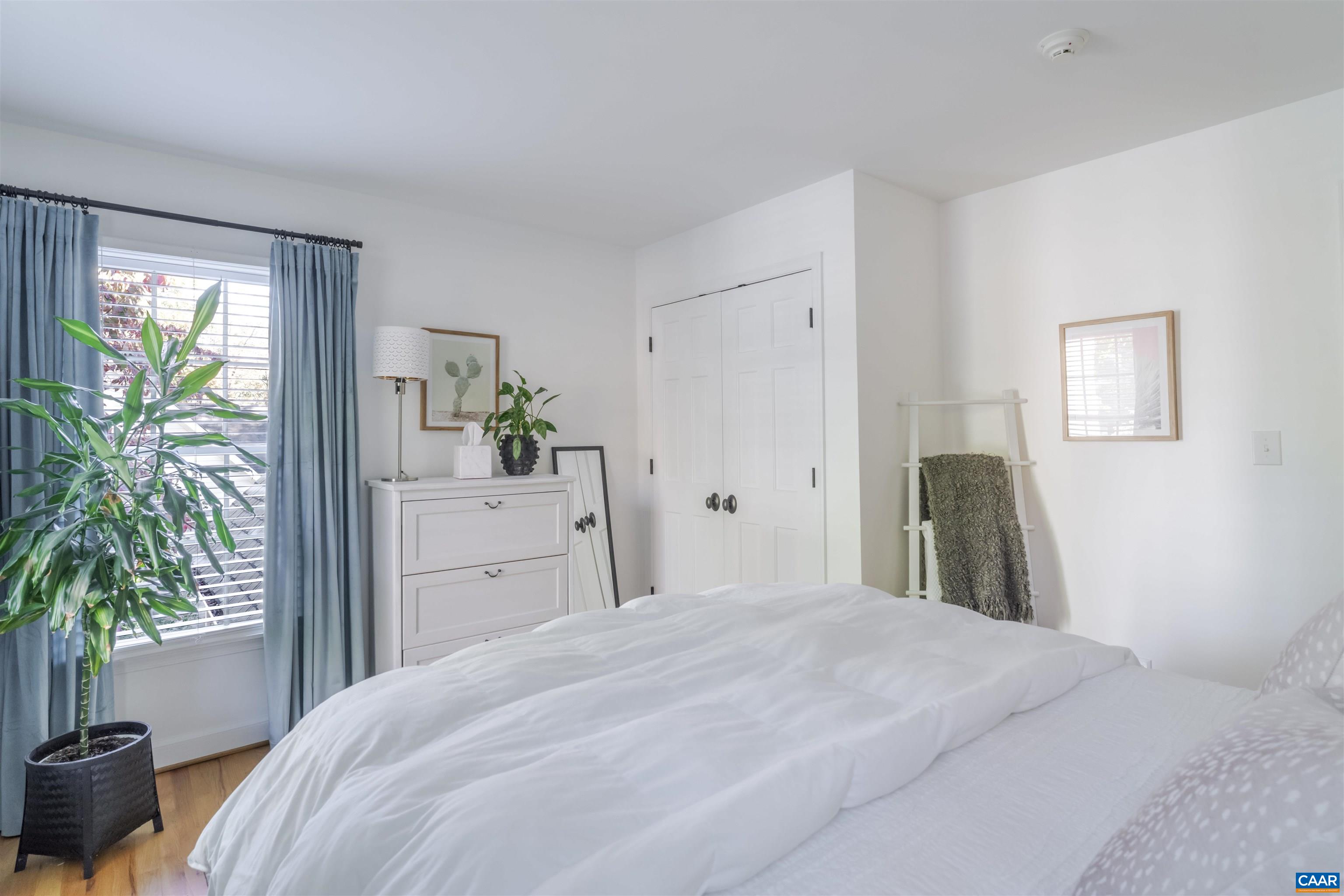 3359 Marsden Point Keswick, VA 22947 - Photo 38 of 47 a bedroom with a bed and a potted plant