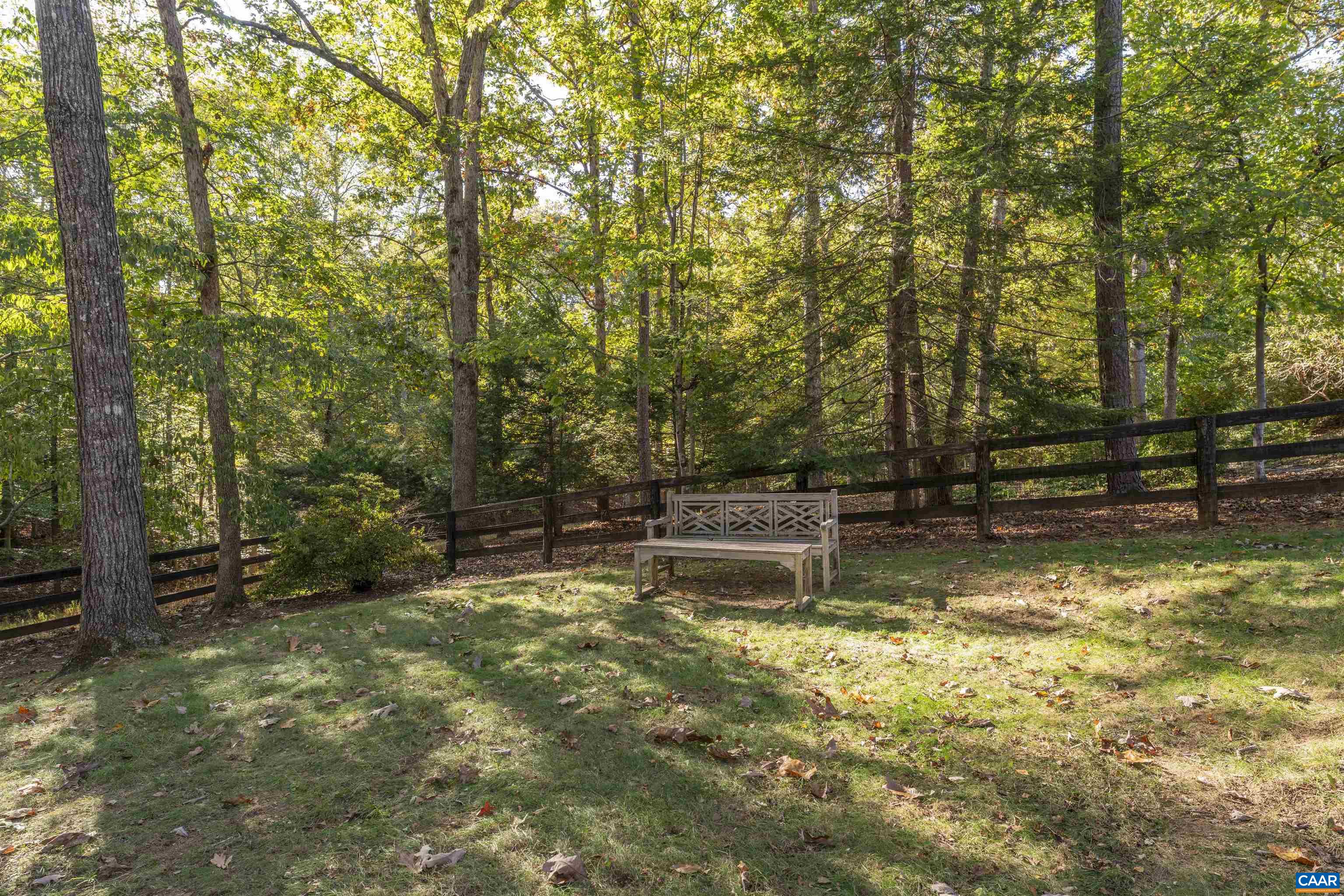 3359 Marsden Point Keswick, VA 22947 - Photo 9 of 47 a view of a swimming pool with a bench and trees around