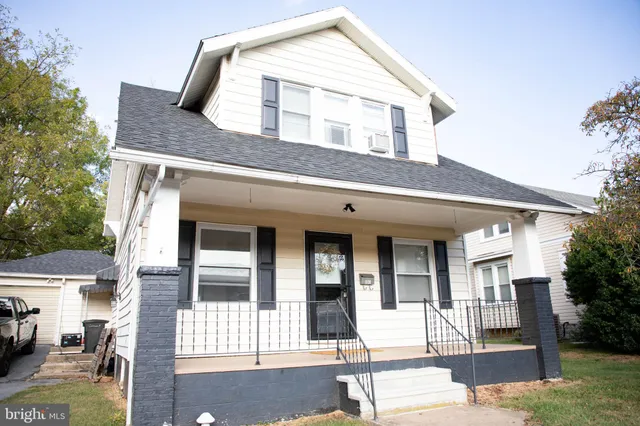 a front view of a house with a garage