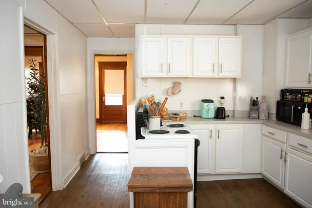 a kitchen with cabinets and appliances
