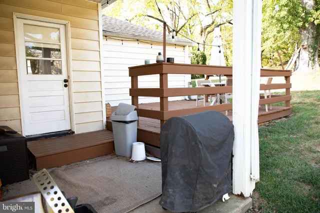 a view of a two chairs and table in the balcony