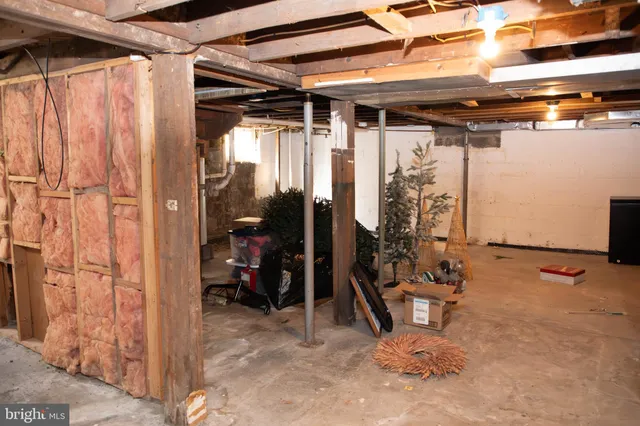 a bedroom with bed and a window