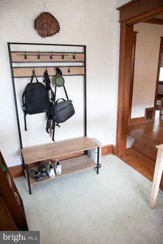 a view of a room with wooden floor
