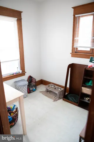 a white toilet sitting next to a bathroom sink