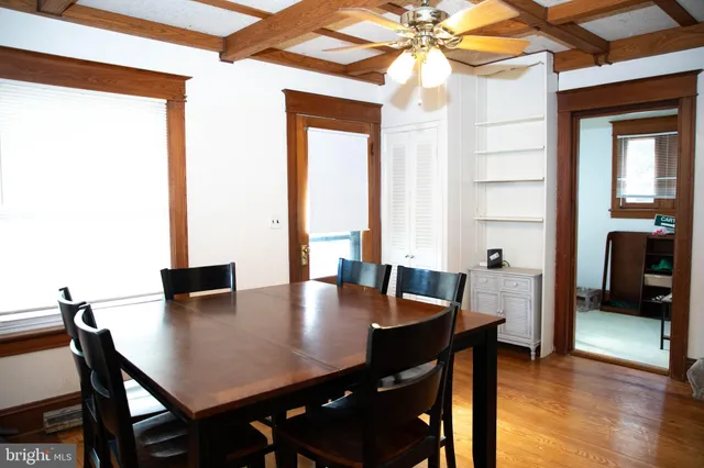 a view of a dining room with furniture and window
