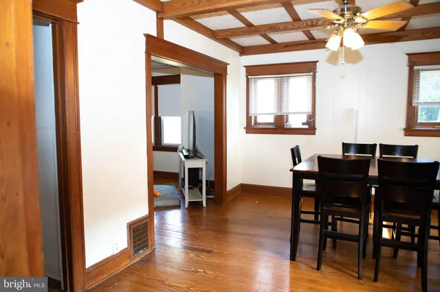 a view of a dining room with furniture and window