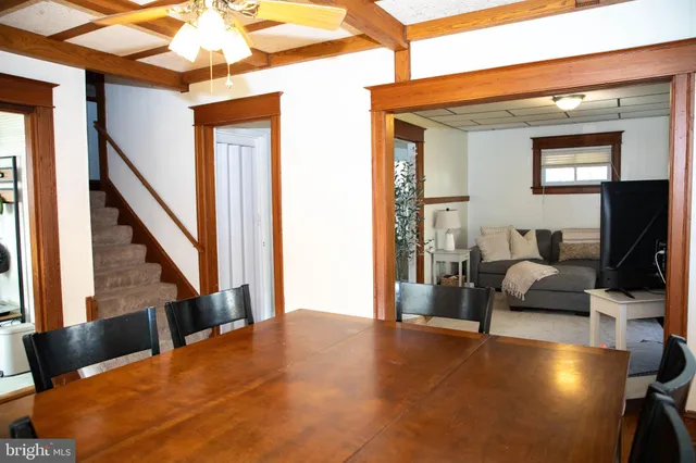 a bedroom with furniture and a flat screen tv