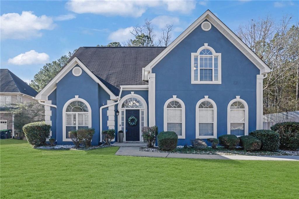 5696 Kilrush Court Mableton, GA 30126 - Photo 1 of 46 a front view of a house with garden
